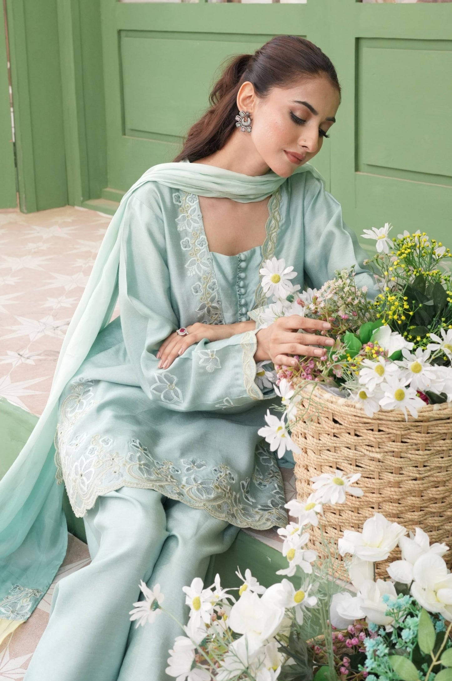 A Timeless Piece That Stands Out Every Time, This Beautiful Shalwar Kameez Is Made From Pure Raw Silk With Floral Applique Work And Neck Details To Enhance It’s Appearance, Worn With Tulip Shalwar Paired Witha Silk Duapatta With Oraganza Detailing.
Fabric: Raw Silk, Silk